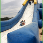 Adults and Kids Coming Down the Slide