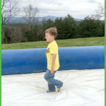 Cute Little Boy Walking on Slide