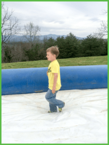 Cute Little Boy Walking on Slide